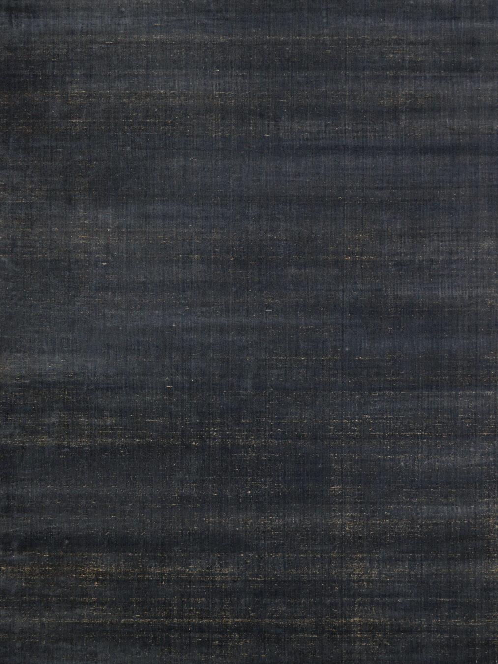 overhead image of the Ravira-charcoal-Honey rug