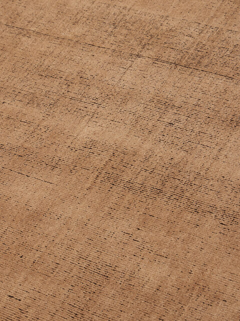 close up image of Ravira handknot rug in peach and coffee colours
