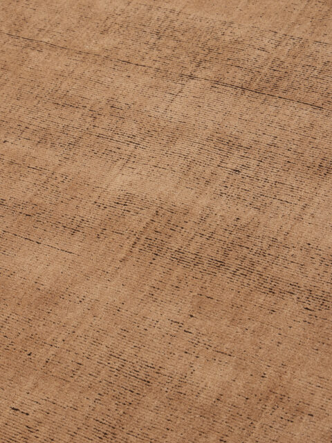 close up image of the Ravira peach coffee rug