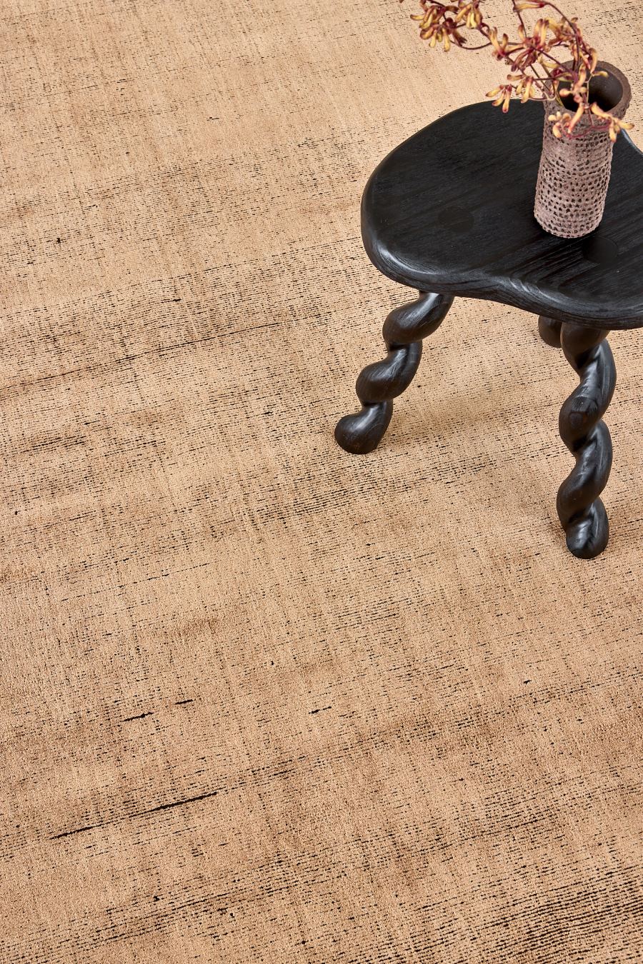 close up image of the ravira peach coffee rug
