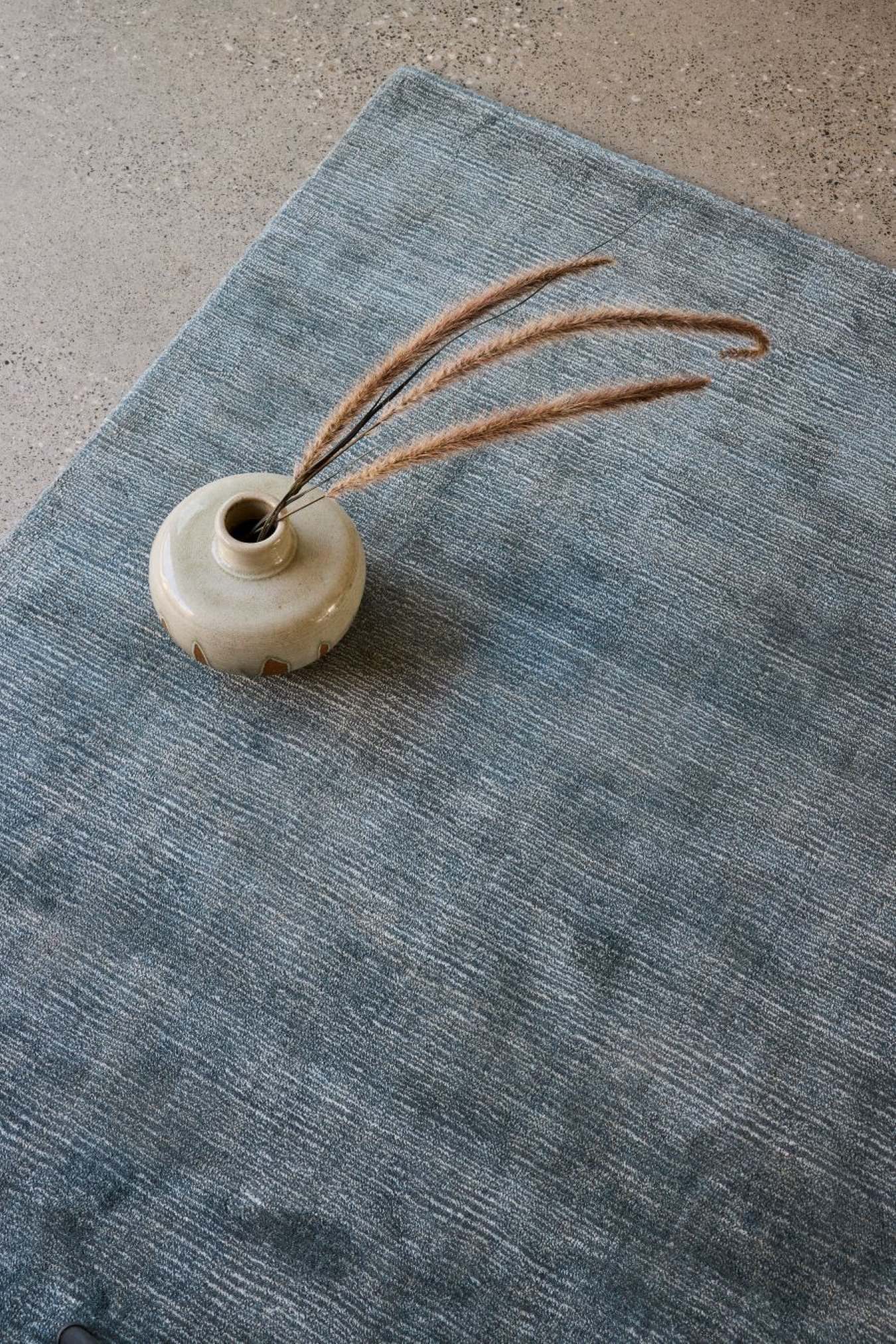 close up image of the sabi-prussian rug