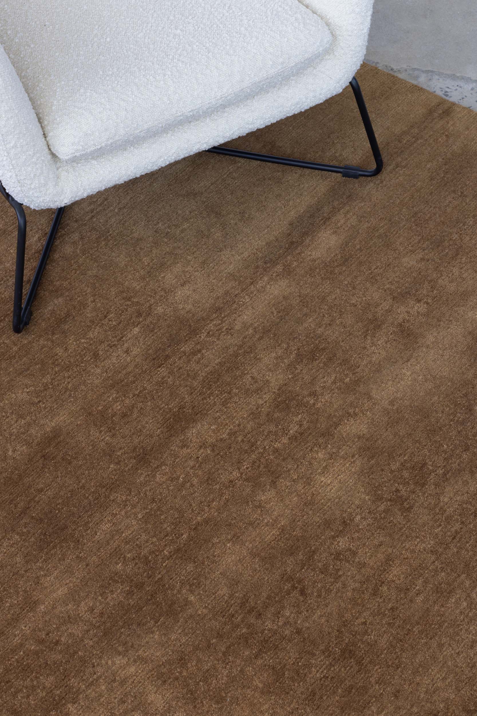 Close up image of the dark Bronze texture rug