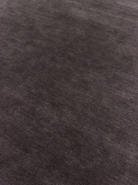 close up image of the summit black-plum rug
