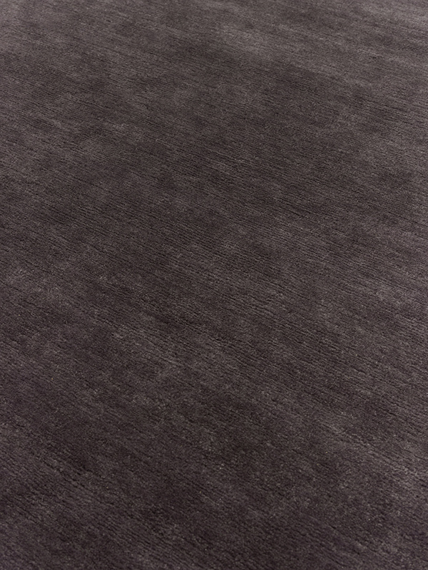 close up image of the summit black-plum rug