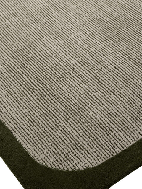 Close up image of the wolfram green-cement rug with border