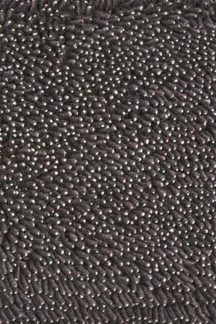 Close up view of textured Coral Shag rug in indigo colour