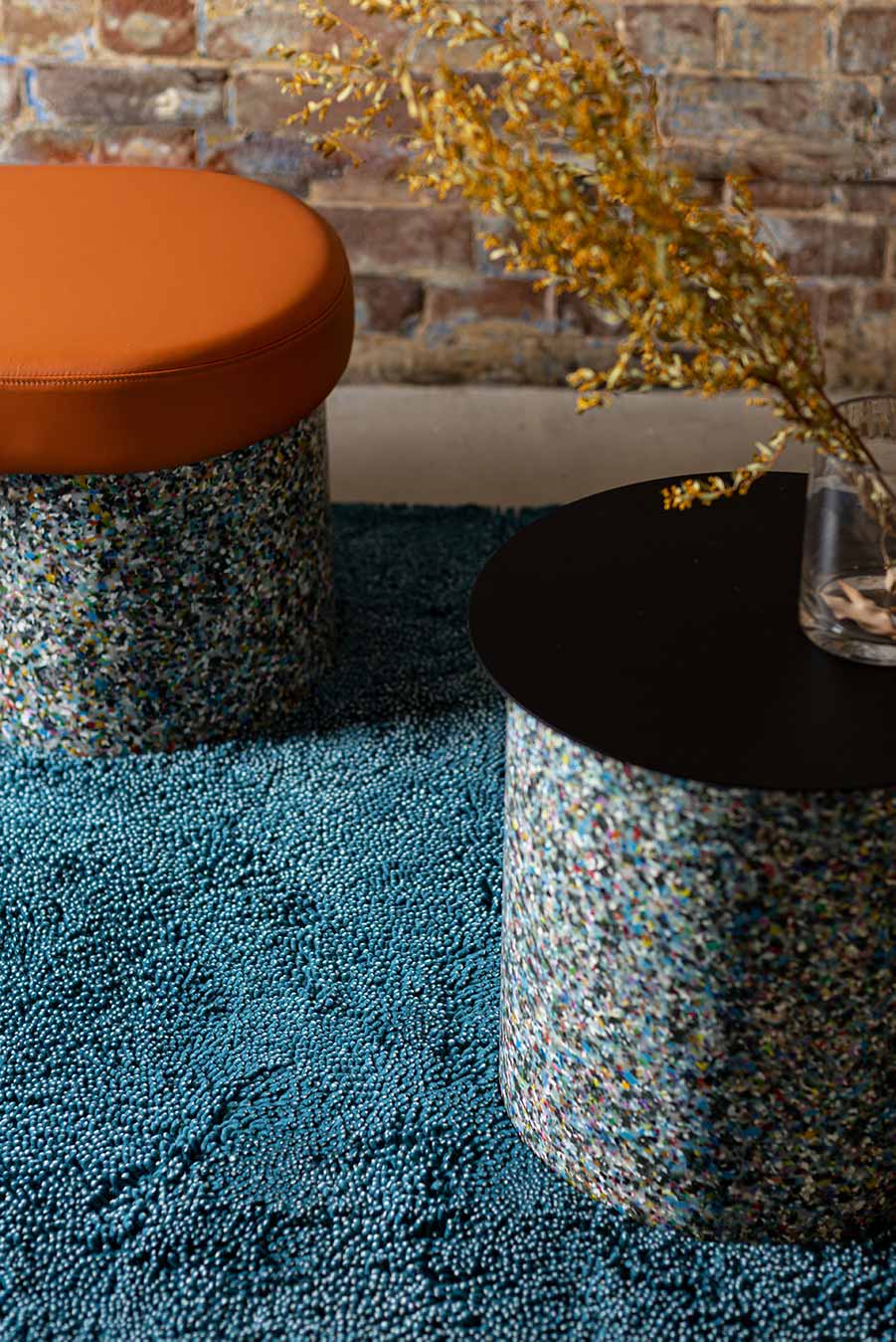 Close up dining room view of textured Coral Shag Pile rug in teal colour