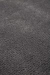 Close up view of textured Napoleon Jay Shag rug in grey colour