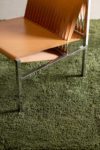 Close up living room view of textured Napoleon Shag rug in olive green colour