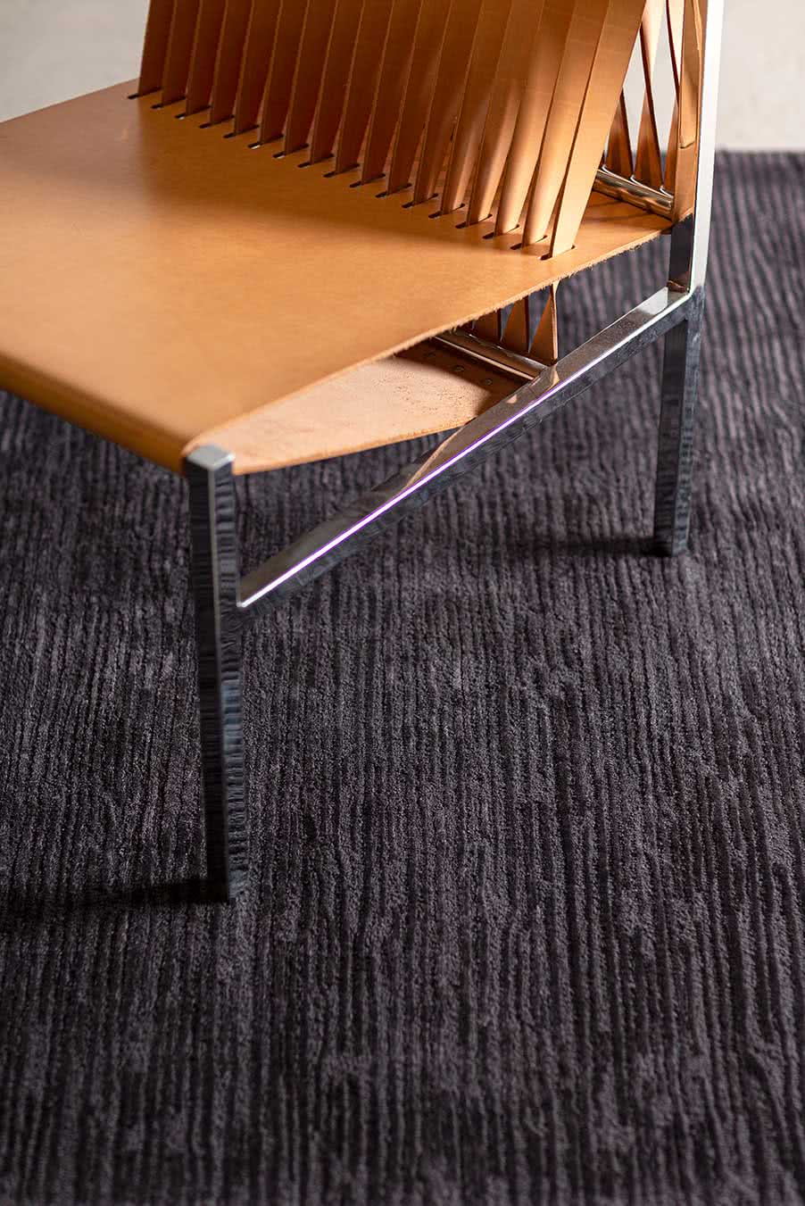 Close up view of textured Rhodium rug in charcoal colour