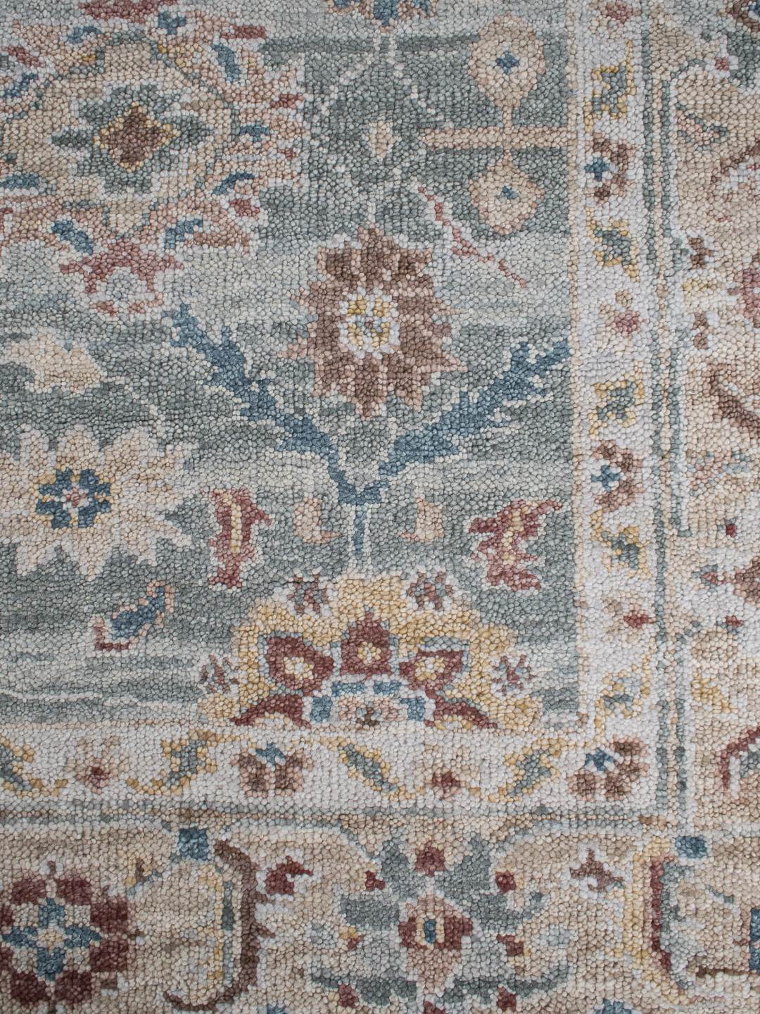 close up image of the Haveli seafoam handknotted rug, showcasing its intricate texture