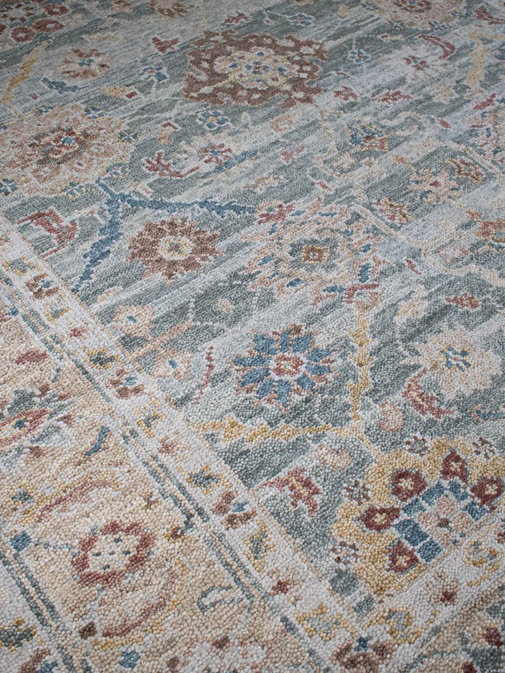 close up image of the Haveli seafoam handknotted rug, showcasing its intricate texture