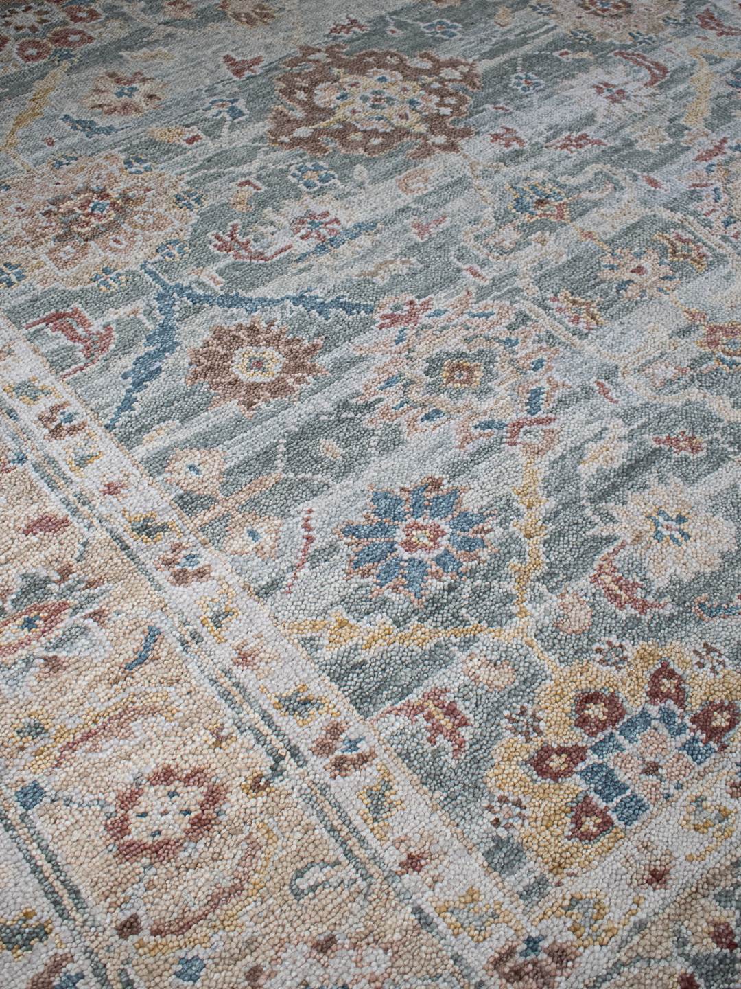close up image of the Haveli seafoam handknotted rug, showcasing its intricate texture