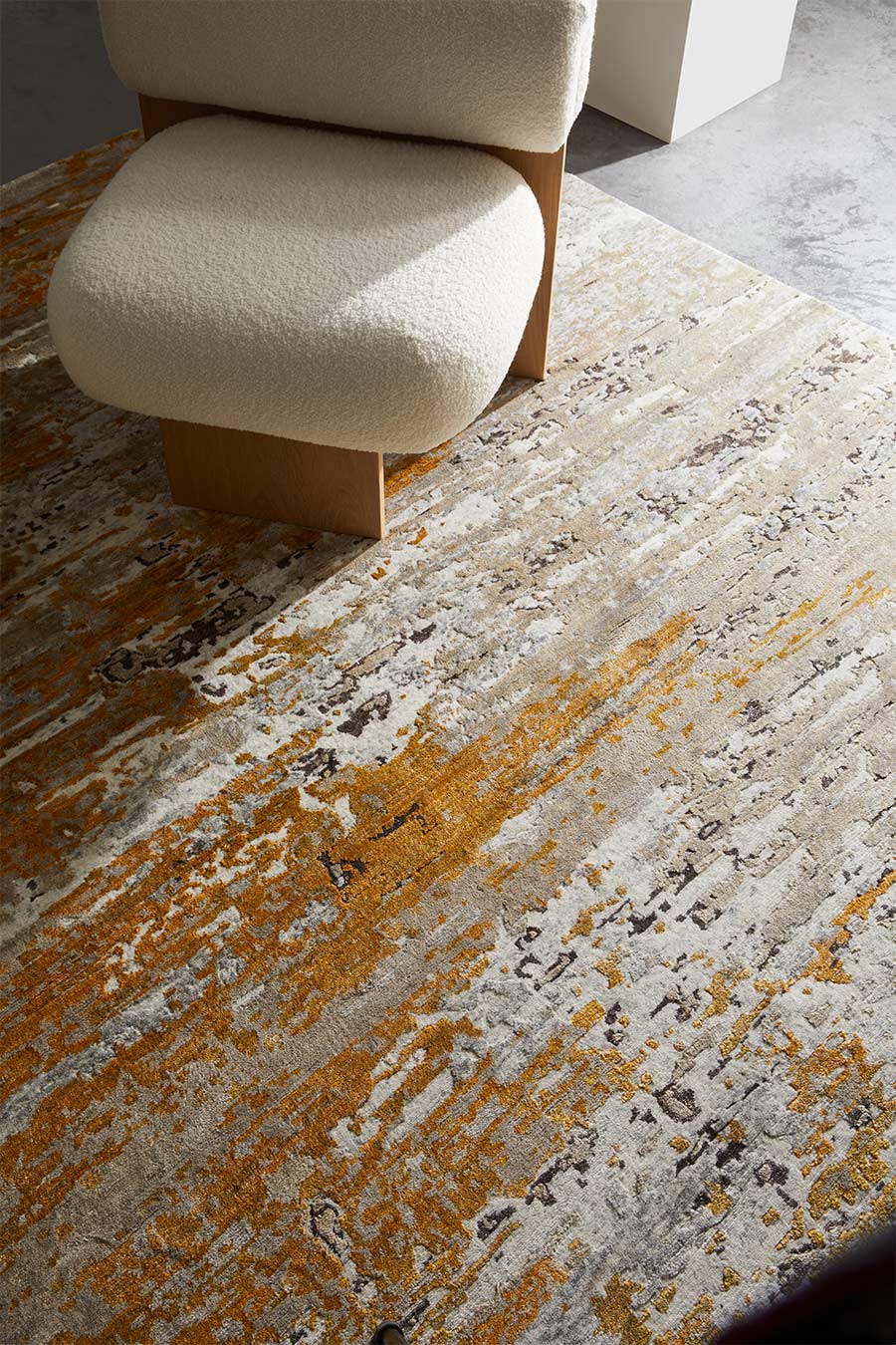 Detailed view of distressed Aegean rug in gold colour
