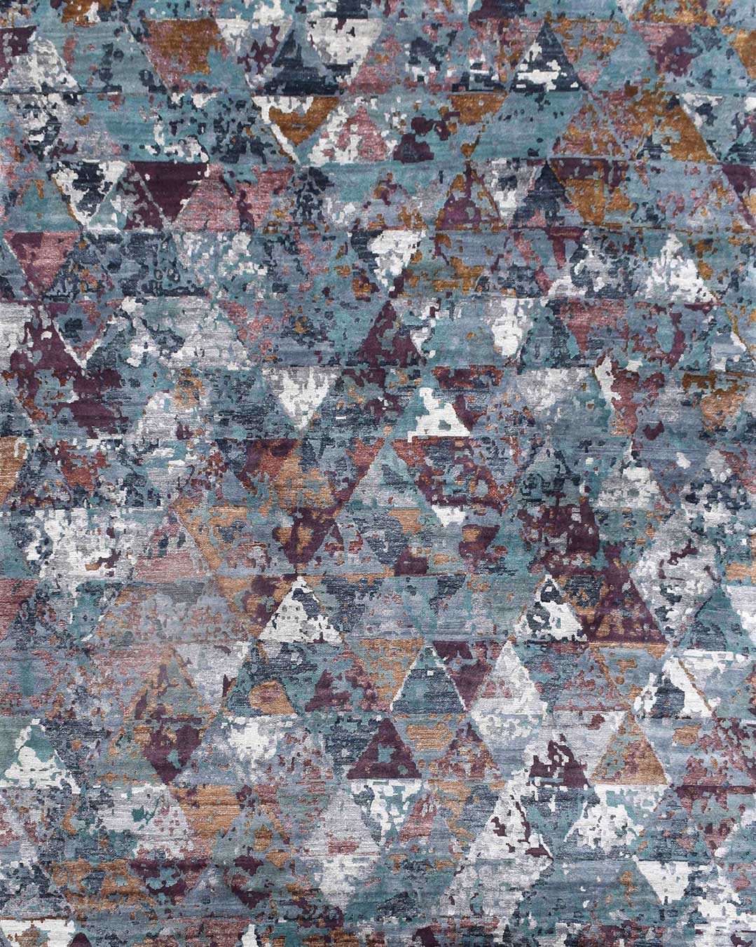 Overhead image of geometric Madagascar rug in blue and pink colour