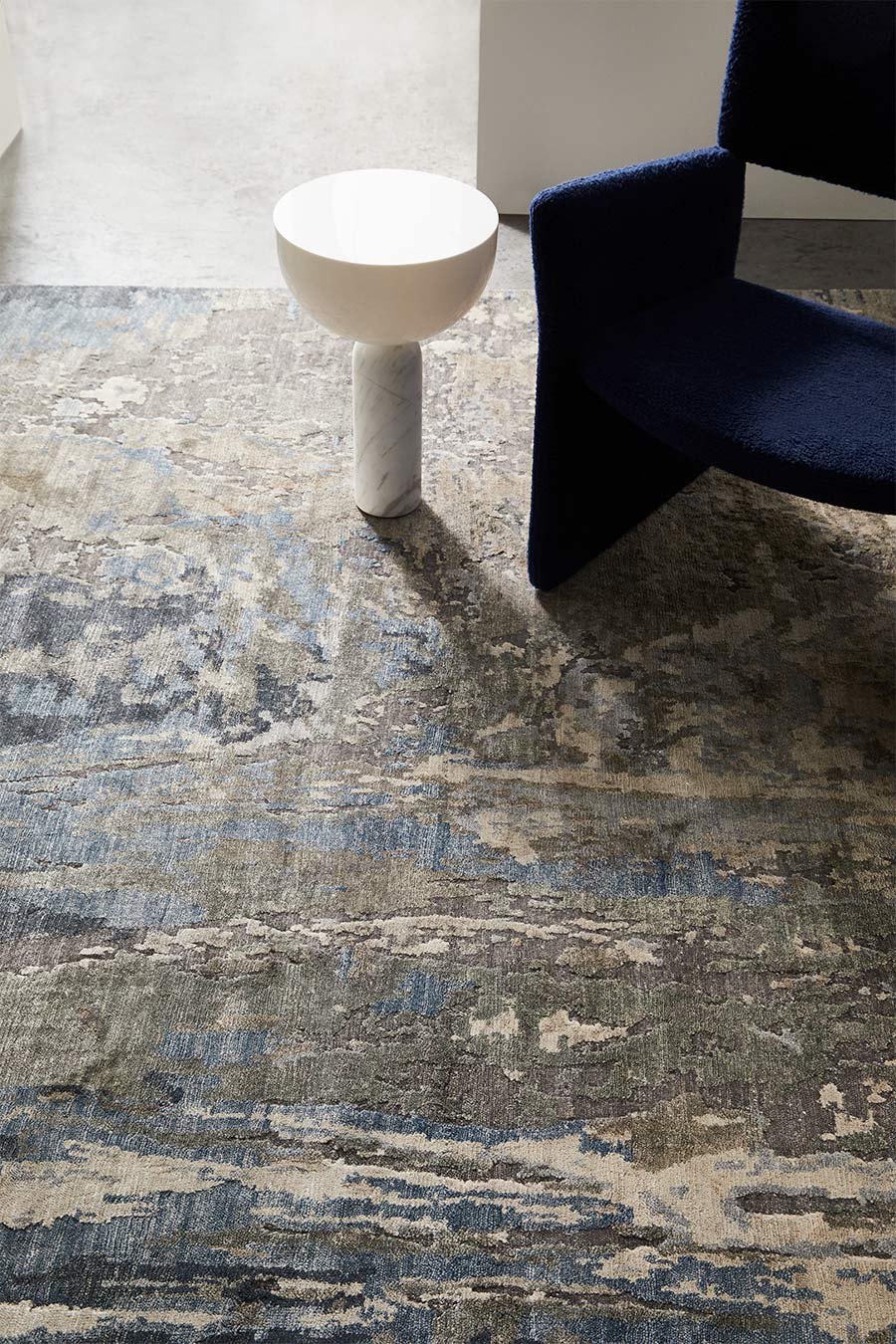 Close up image of abstract Neptune rug in blue colour