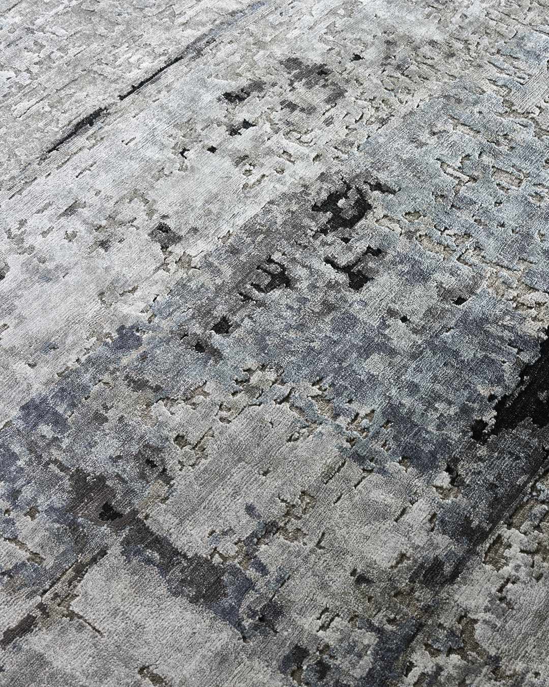 Detailed image of distressed Orion rug in beige and blue colour