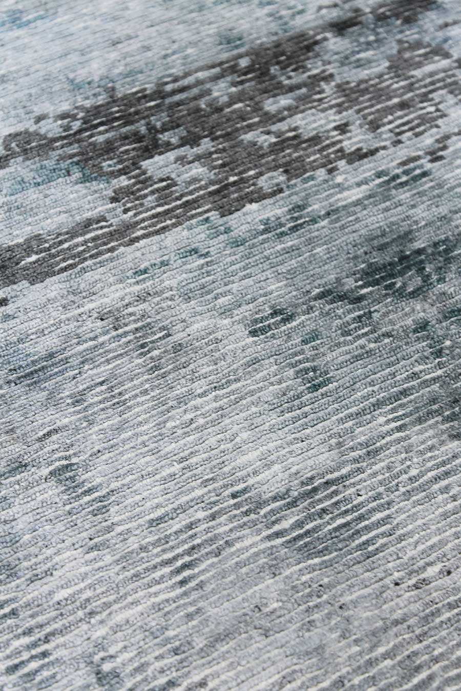 Detailed image of distressed Seamist rug in blue colour