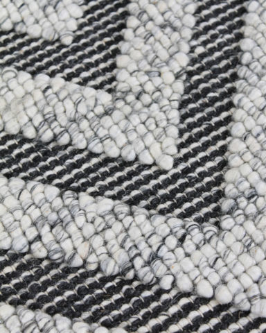 Close up image of textured Zephyr rug in grey colour