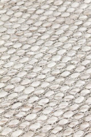Detailed view of textured Cocos rug in beige colour
