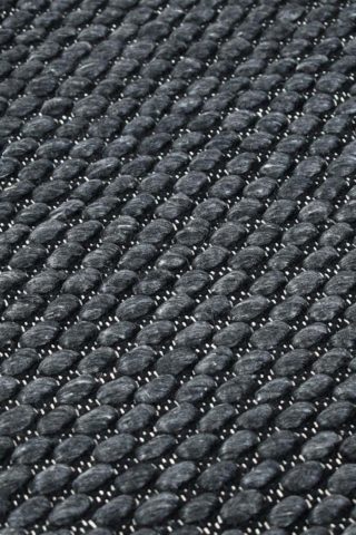 Detailed view of textured Cocos rug in charcoal colour