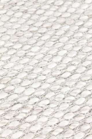 Detailed view of textured Cocos rug in ivory colour