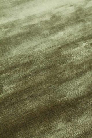 Close up view of metallic Glam rug in olive green colour