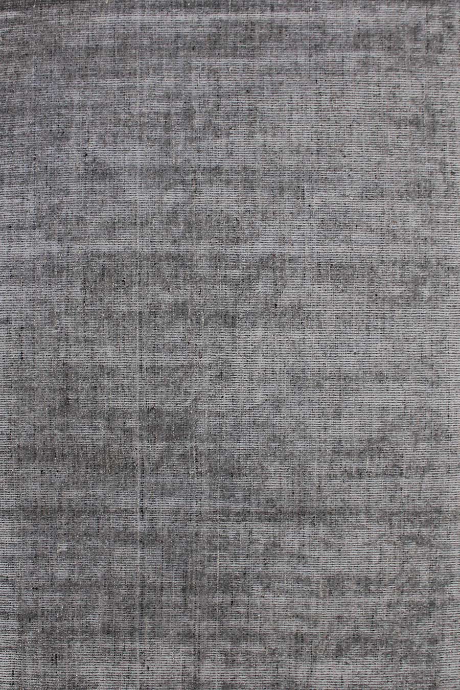 Overhead image of textured Gomez rug in dark grey colour