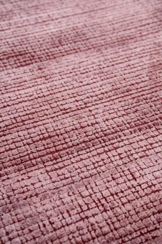 Detailed view of textured Molten rug in red colour