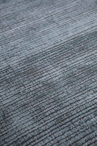 Detailed view of textured Molten rug in blue colour