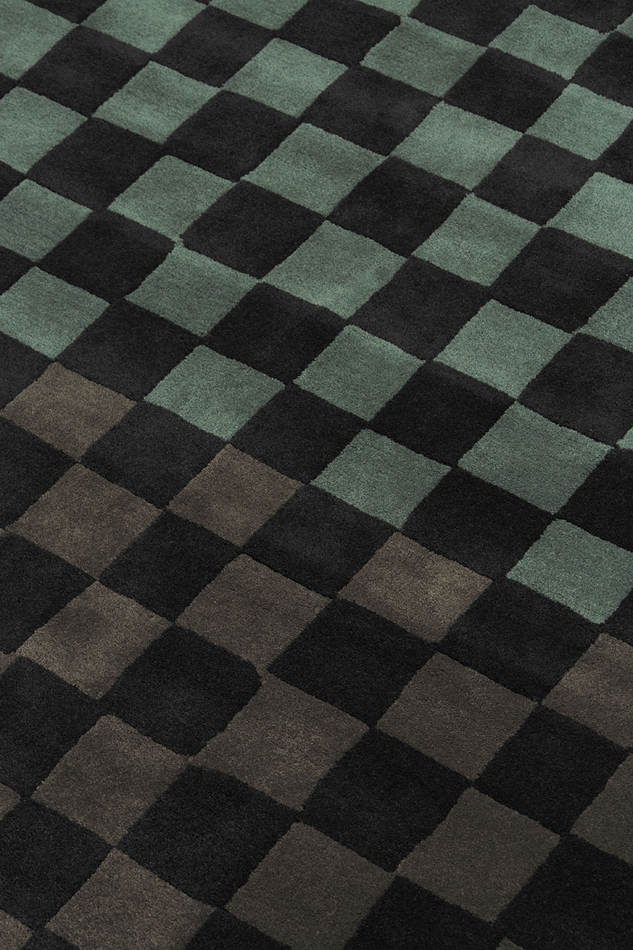 Detailed image of checkered Checkmate rug in green