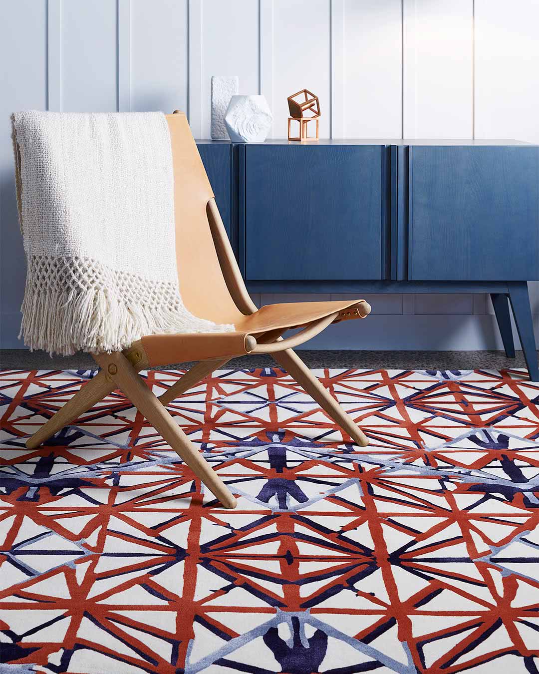 Living room setting of our modern, geometrically patterned Attic rug in charcoal