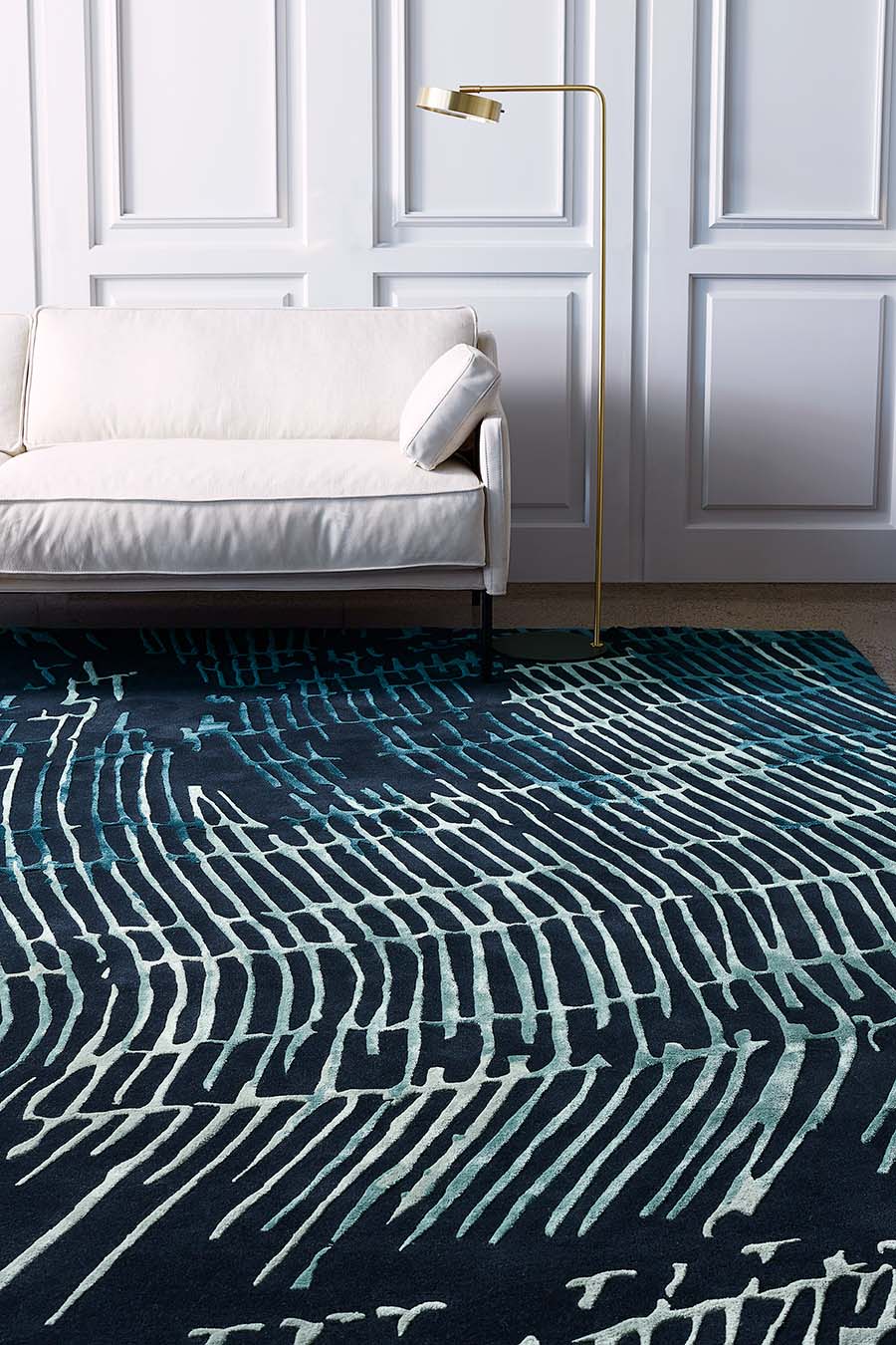 Room setting with our modern, organic patterned Current rug design in green, teal and charcoal