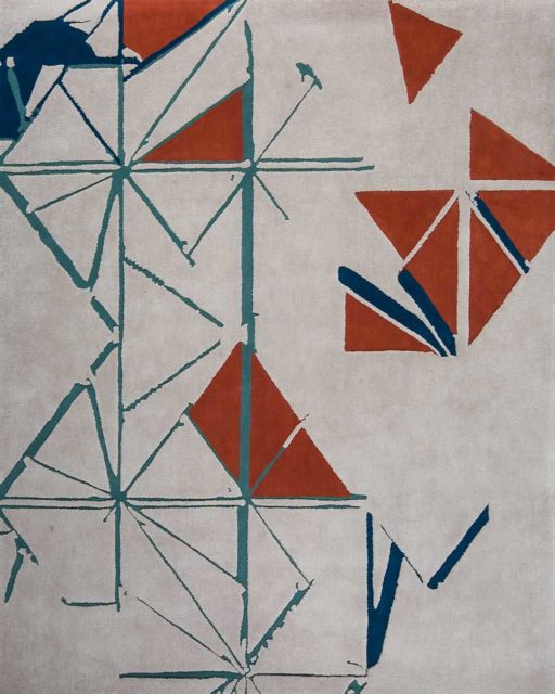 Detail view of our geometric and modern Despatch rug design in orange and teal