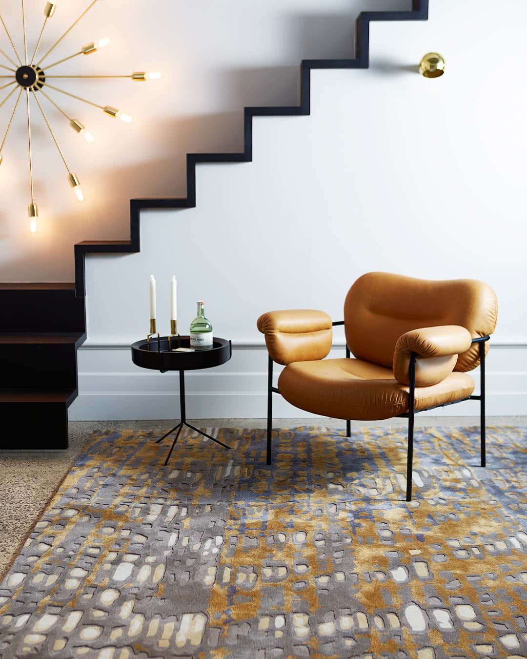 Room setting with our modern, textured Eden rug in brown and gold