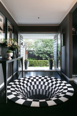 Black Hole hand tufted rug by Daniel Malik