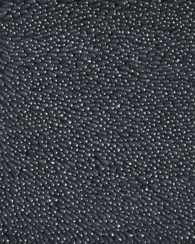 Close up view of textured Coral Shag rug in charcoal colour