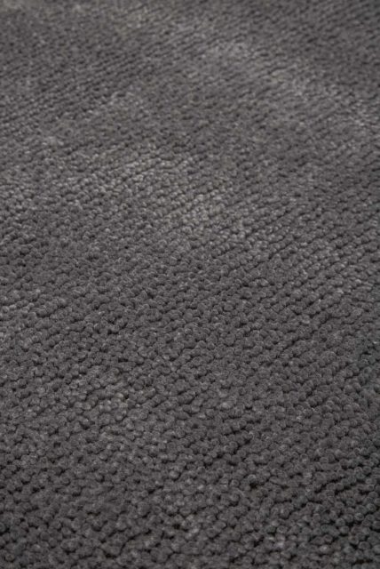 Close up view of textured Napoleon Jay Shag rug in grey colour