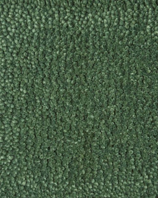 Close up view of textured Napoleon Jay Shag rug in light green colour