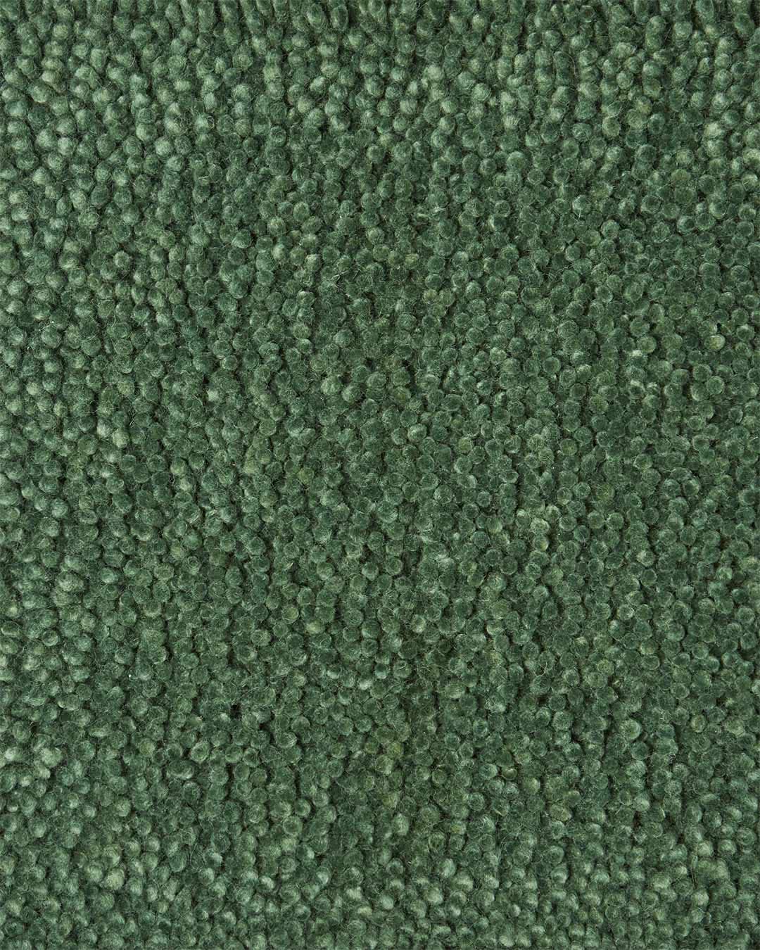 Close up view of textured Napoleon Jay Shag rug in light green colour