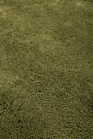 Close up view of textured Napoleon Shag rug in olive green colour