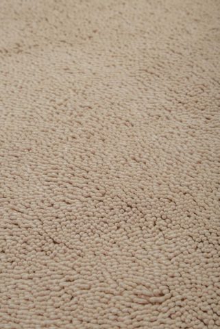 Close up view of textured Napoleon Shag rug in beige colour