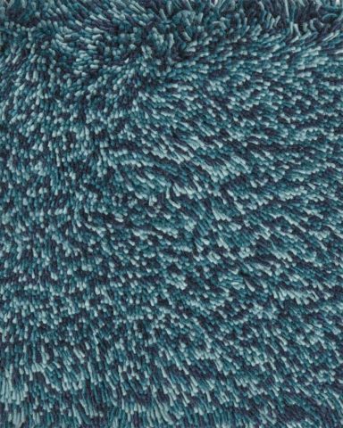 Close up view of textured Stipple Shag rug in teal blue colour